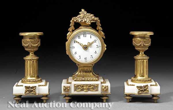 Appraisal: A French Gilt Bronze and Marble Boudoir Clock Garniture the