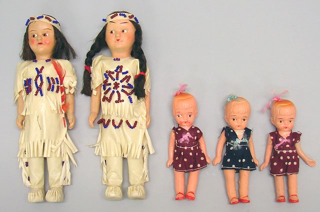 Appraisal: Lot of painted bisque dolls Molded loop-in-hair dolls dressed in