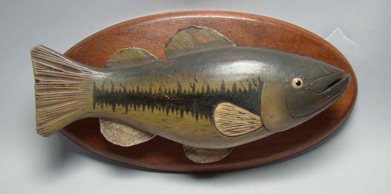 Appraisal: MODERN CARVED WOODEN LARGEMOUTH BASS Mounted on a wooden plaque