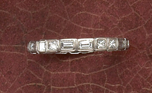 Appraisal: DIAMOND ETERNITY BAND Platinum band set with an alternating pattern