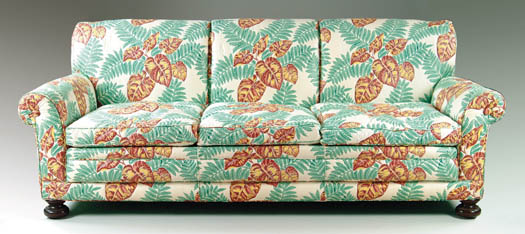 Appraisal: THREE SEAT UPHOLSTERED SOFA Sofa upholstered in a tropical leaf