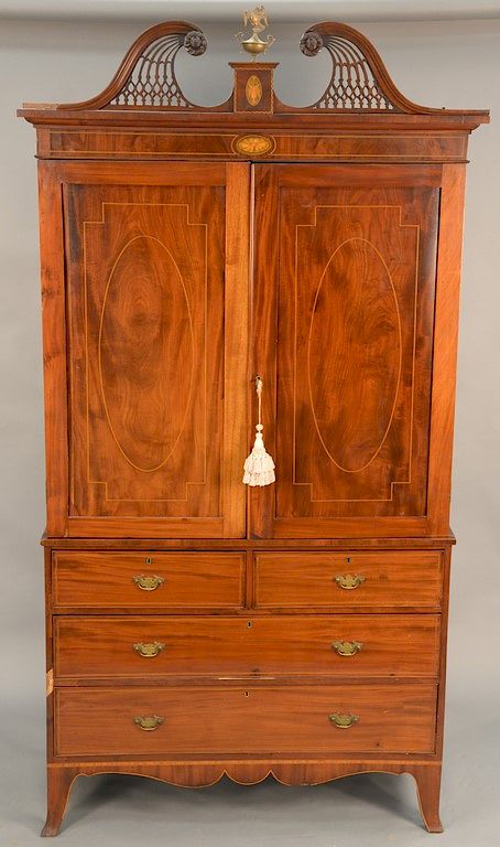 Appraisal: George IV mahogany linen press having pierced carved broken arch