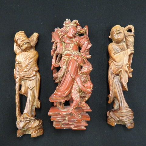 Appraisal: Chinese Carved Wooden Figurines tall one with lady monkey having