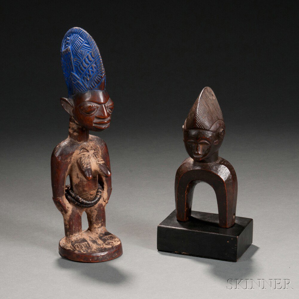 Appraisal: Two African Carvings a Yoruba female Ibeji doll and a