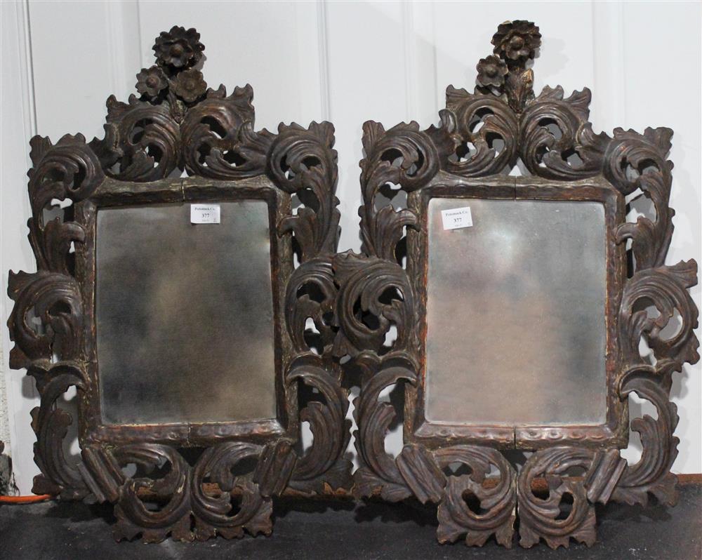 Appraisal: PAIR OF EARLY BAROQUE STYLE FOLIATE CARVED AND PIERCED MIRRORS