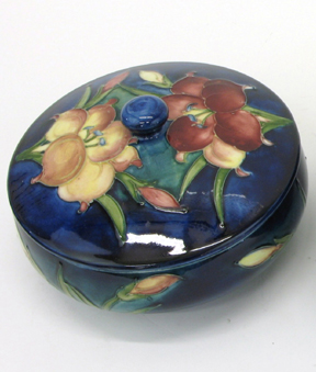 Appraisal: MOORCROFT GLAZED ART POTTERY COVERED BOX - D having burgundy