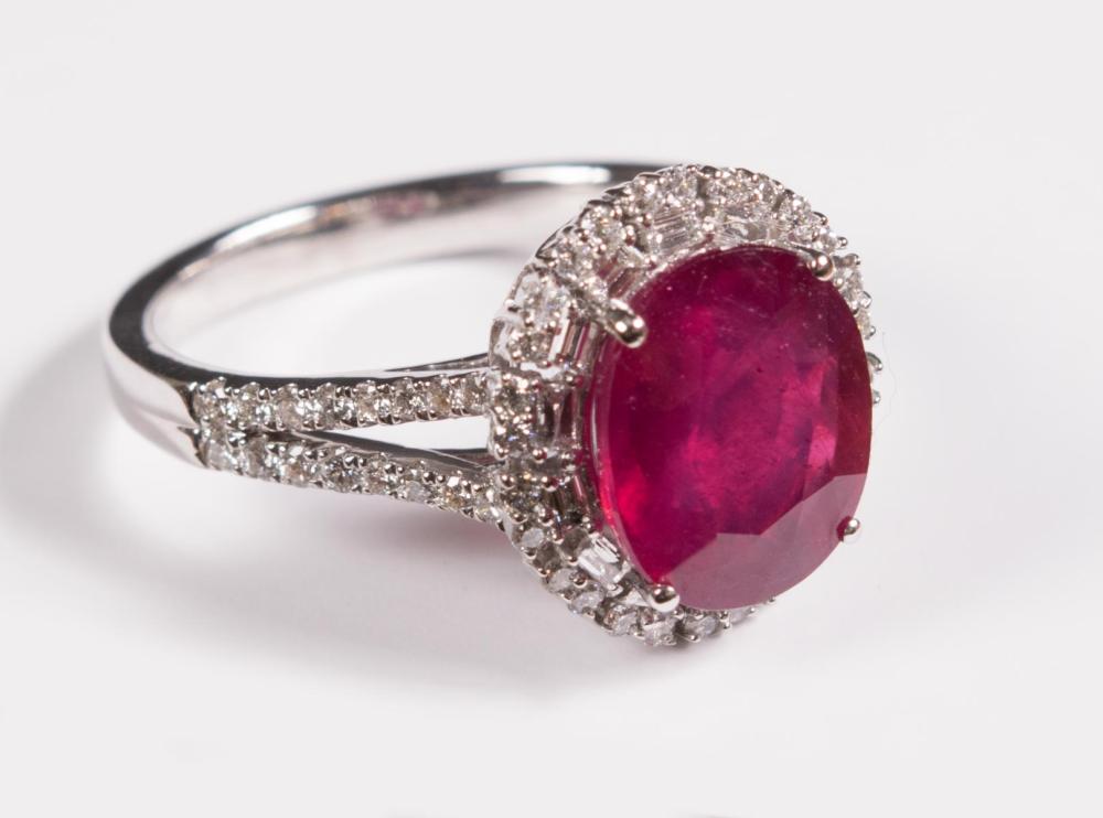 Appraisal: PLATINUM RING WITH RUBY AND DIAMONDS with round-cut diamonds and