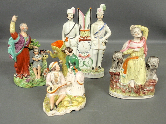 Appraisal: - Four Staffordshire figural groups c incl V Riffles h