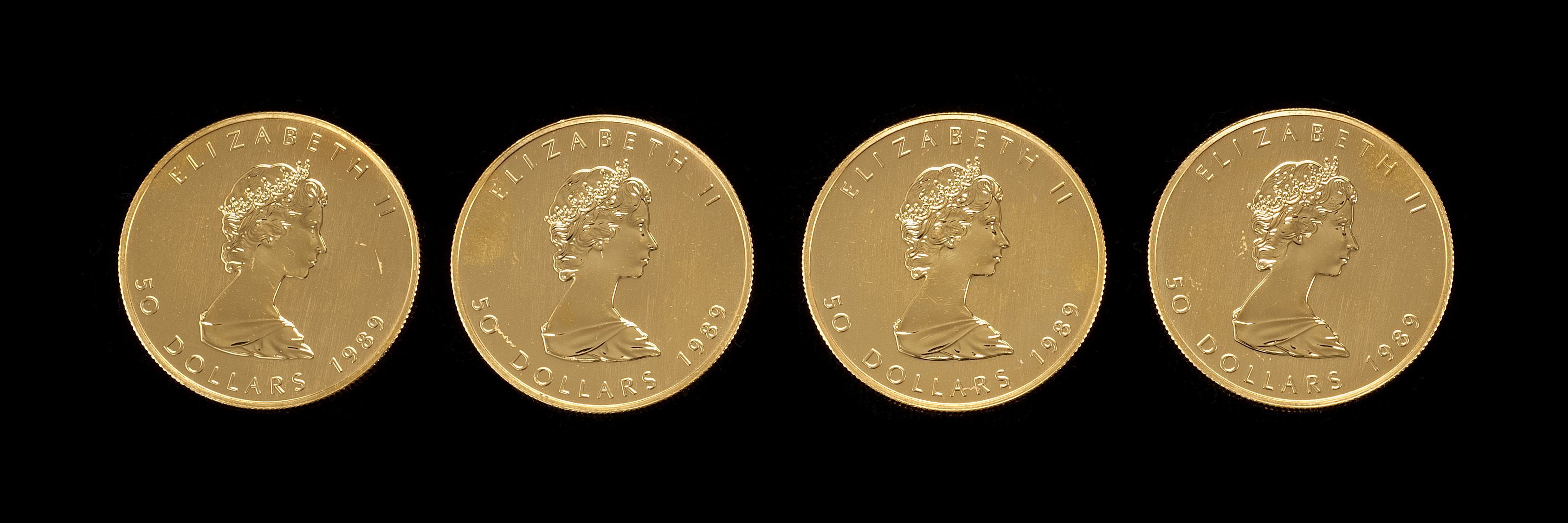 Appraisal: FOUR CANADIAN GOLD FIFTY DOLLAR PIECES