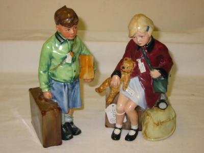 Appraisal: A PAIR OF ROYAL DOULTON PORCELAIN FIGURES The Girl Evacuee