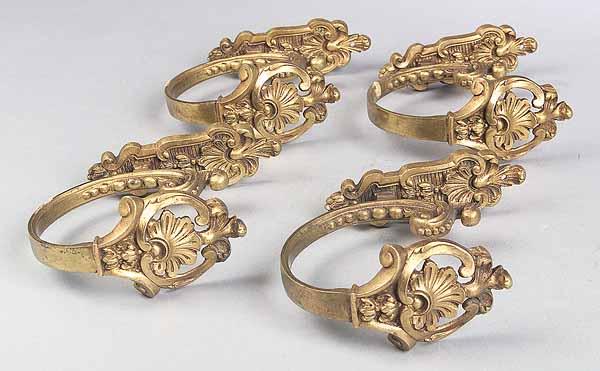 Appraisal: A Set of Four Bronze Dor Curtain Tiebacks in the