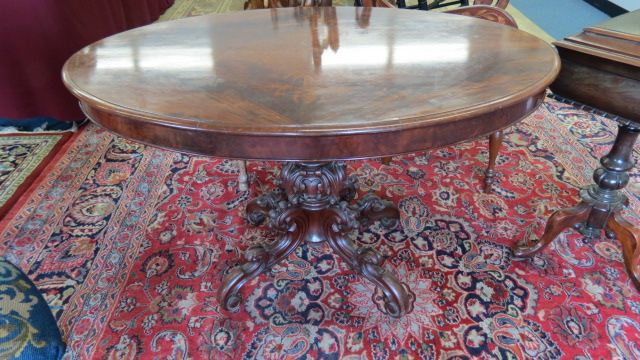 Appraisal: Carved Mahogany Library Table ornate pedestal base oval top X