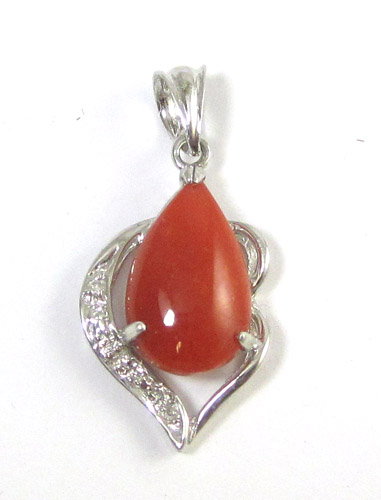 Appraisal: CORAL AND DIAMOND PENDANT k white gold set with three