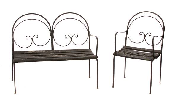 Appraisal: A wrought metal and wood three piece garden set comprising