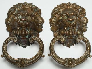 Appraisal: Pair of Gilt Brass Lion's With C-scroll ring H X