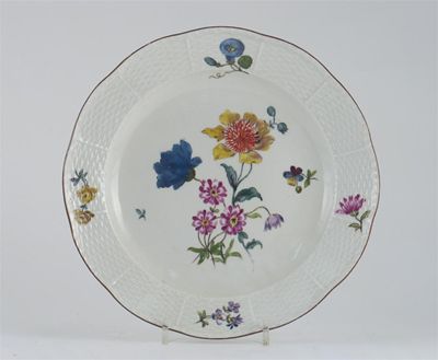 Appraisal: A Meissen plate with moulded osier border painted with flower