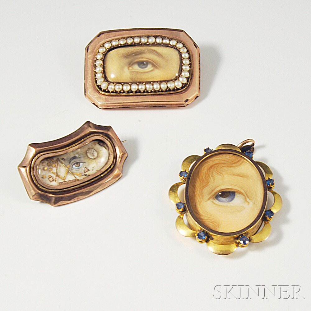 Appraisal: Three kt Gold Lover's Eyes a gem-set pendant and two