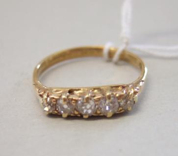 Appraisal: A gold and diamond set five stone ring mounted with