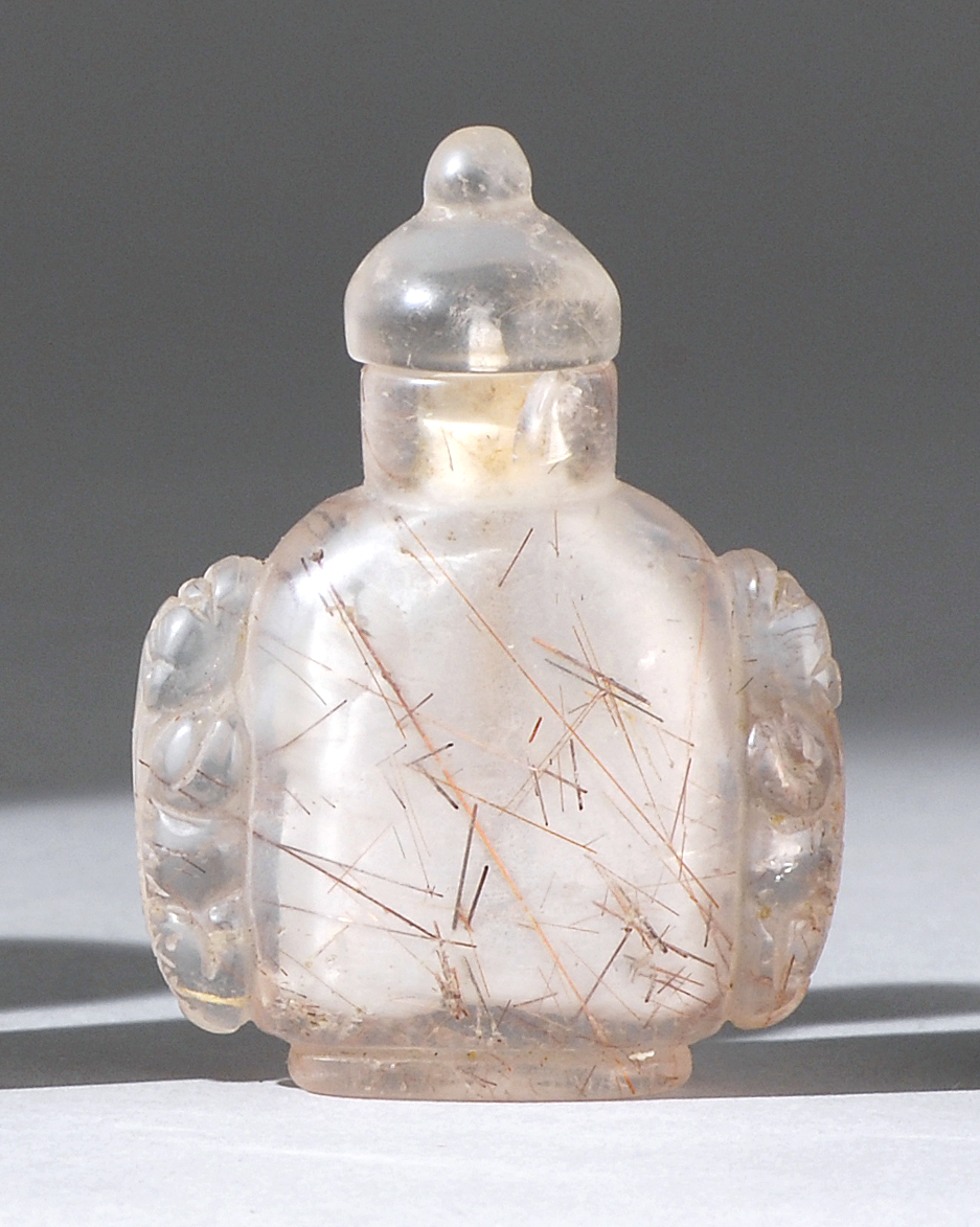 Appraisal: ROCK CRYSTAL SNUFF BOTTLE In flattened ovoid form with black