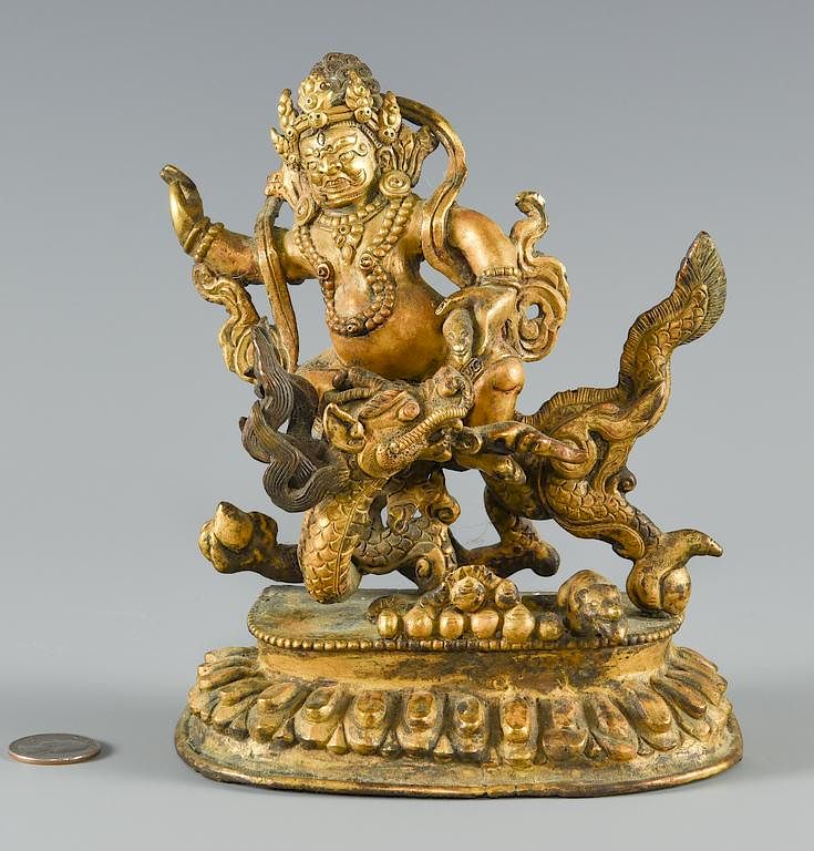 Appraisal: Gilt bronze figure on dragon -part gilt and patinated bronze