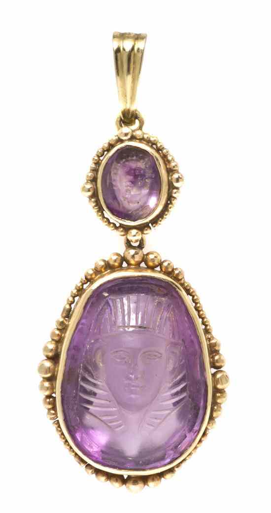 Appraisal: An Antique Yellow Gold and Carved Amethyst Pendant containing two