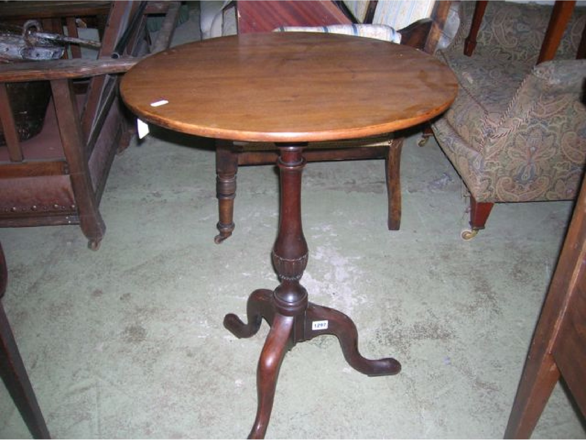 Appraisal: A Georgian mahogany snap top occasional table of circular form