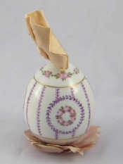 Appraisal: A Russian porcelain egg the white body with hand painted