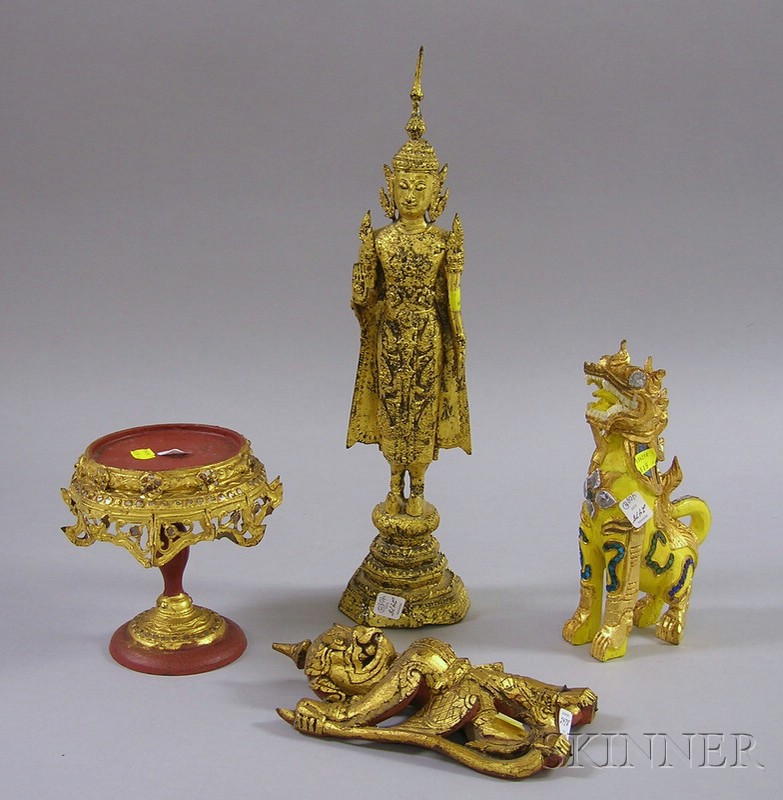 Appraisal: Four Southeast Asian Gilt Items gilt-metal image of a standing