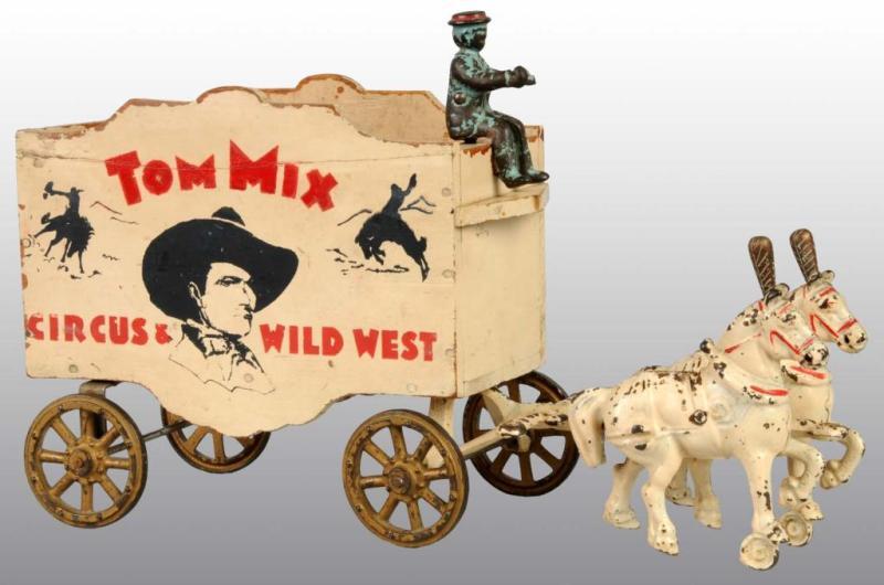 Appraisal: Cast Iron Wood Arcade Tom Mix Wagon Toy Description All