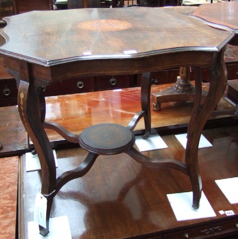 Appraisal: An Edwardian rosewood and marquetry centre table the shaped top