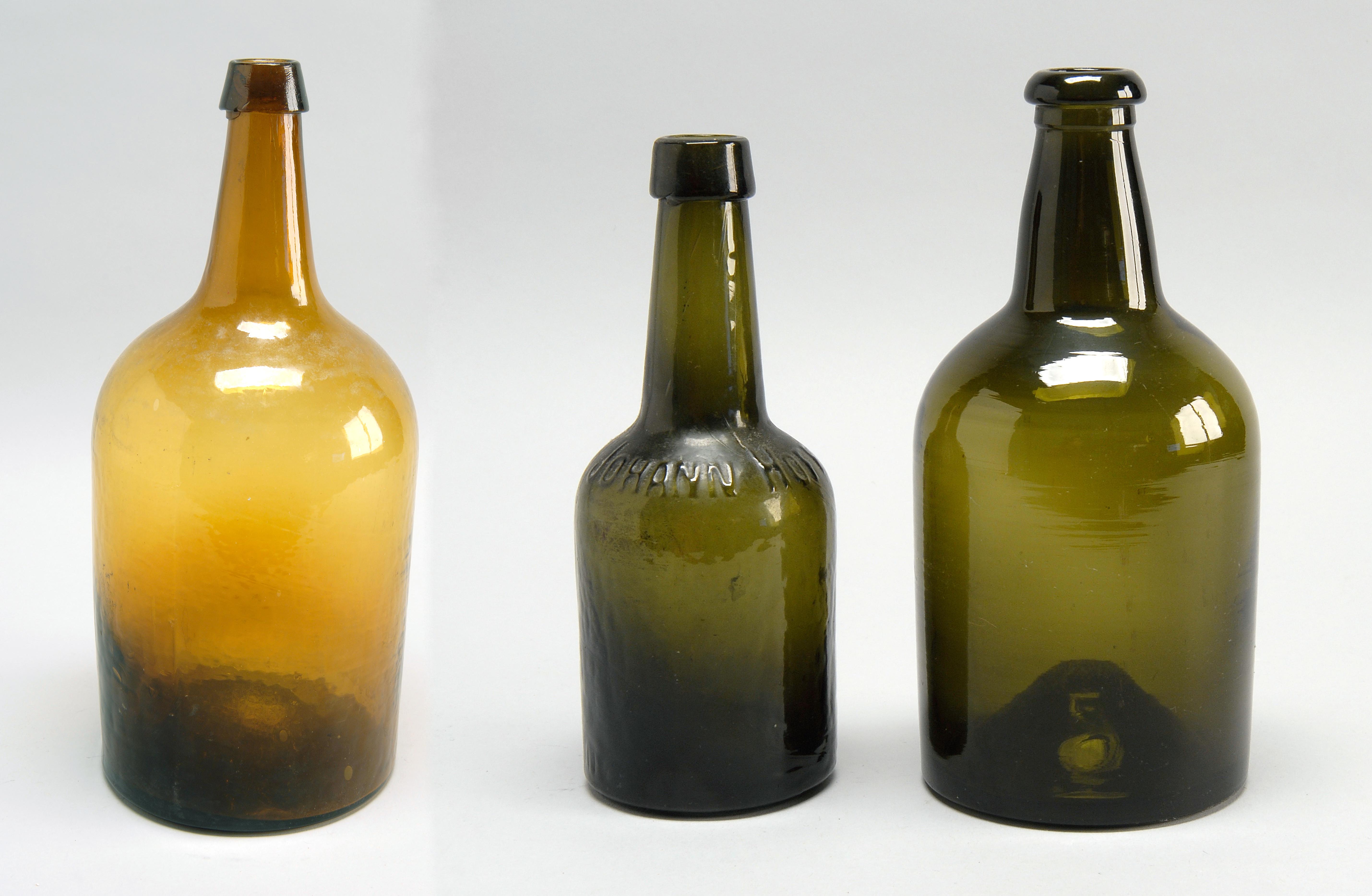 Appraisal: THREE TH CENTURY GLASS BOTTLES one two-part molded glass in