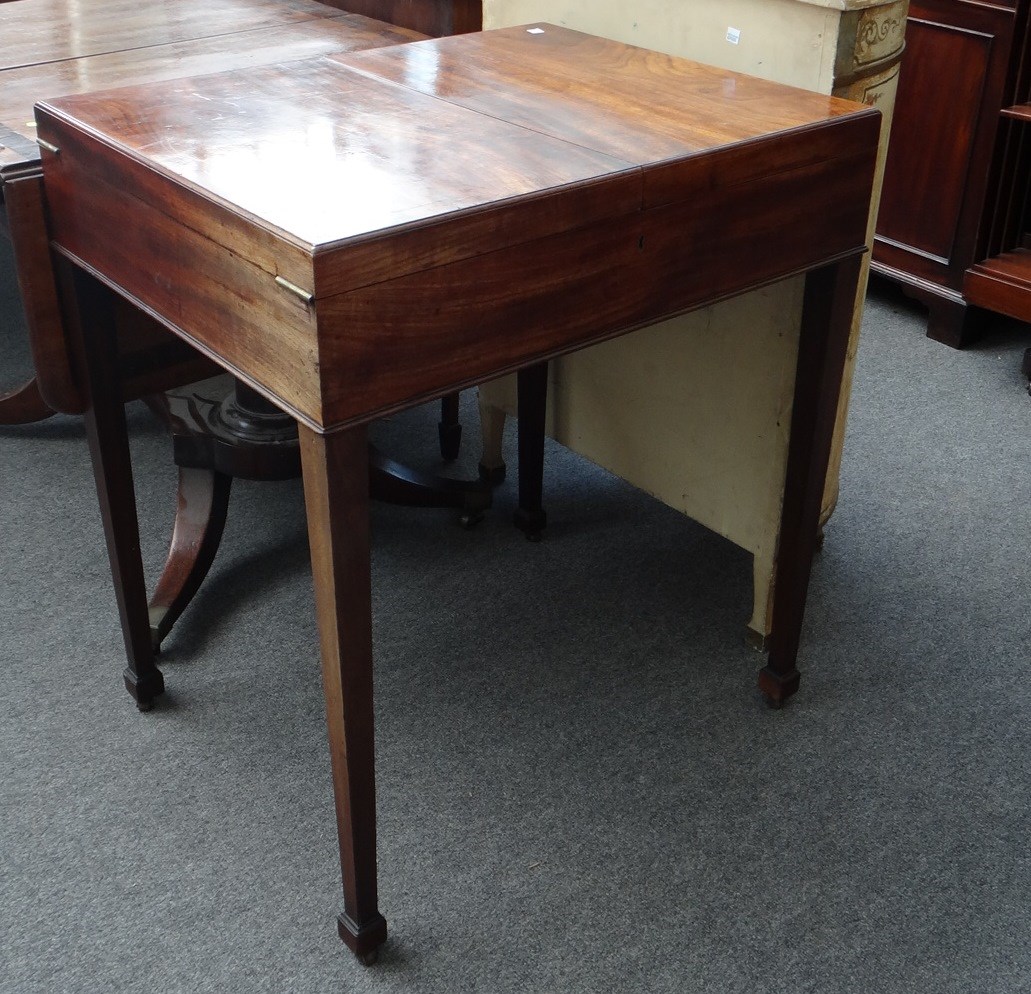 Appraisal: A George III mahogany wash stand the fold out top