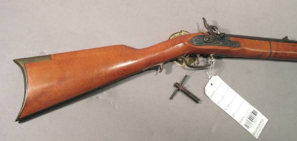 Appraisal: A reproduction full-stocked percussion rifle The inch caliber octagonal barrel