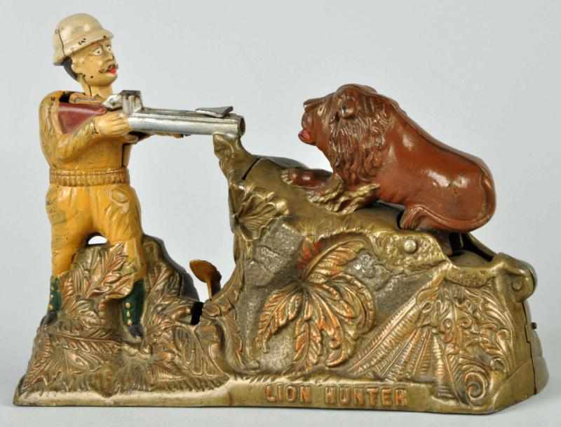 Appraisal: Cast Iron Lion Hunter Mechanical Bank Description Working Manufactured by