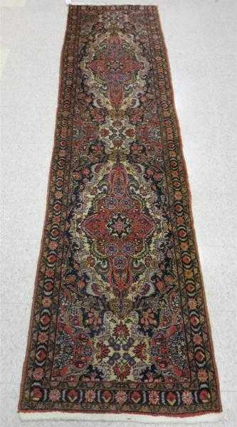 Appraisal: SEMI-ANTIQUE PERSIAN RUNNER Hamadan region northwestern Iran double floral medallion