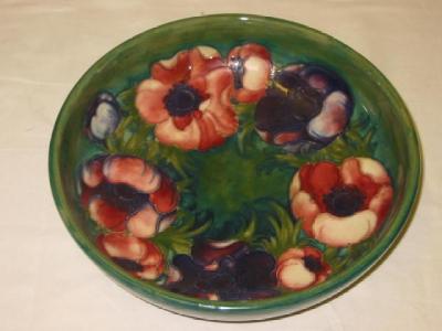 Appraisal: A WALTER MOORCROFT POTTERY BOWL of shallow circular form tube