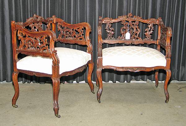 Appraisal: A pair of Austrian Rococo style walnut armchairs last quarter