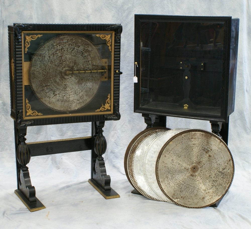 Appraisal: Regina upright disc music box in an ebonized ripple carved