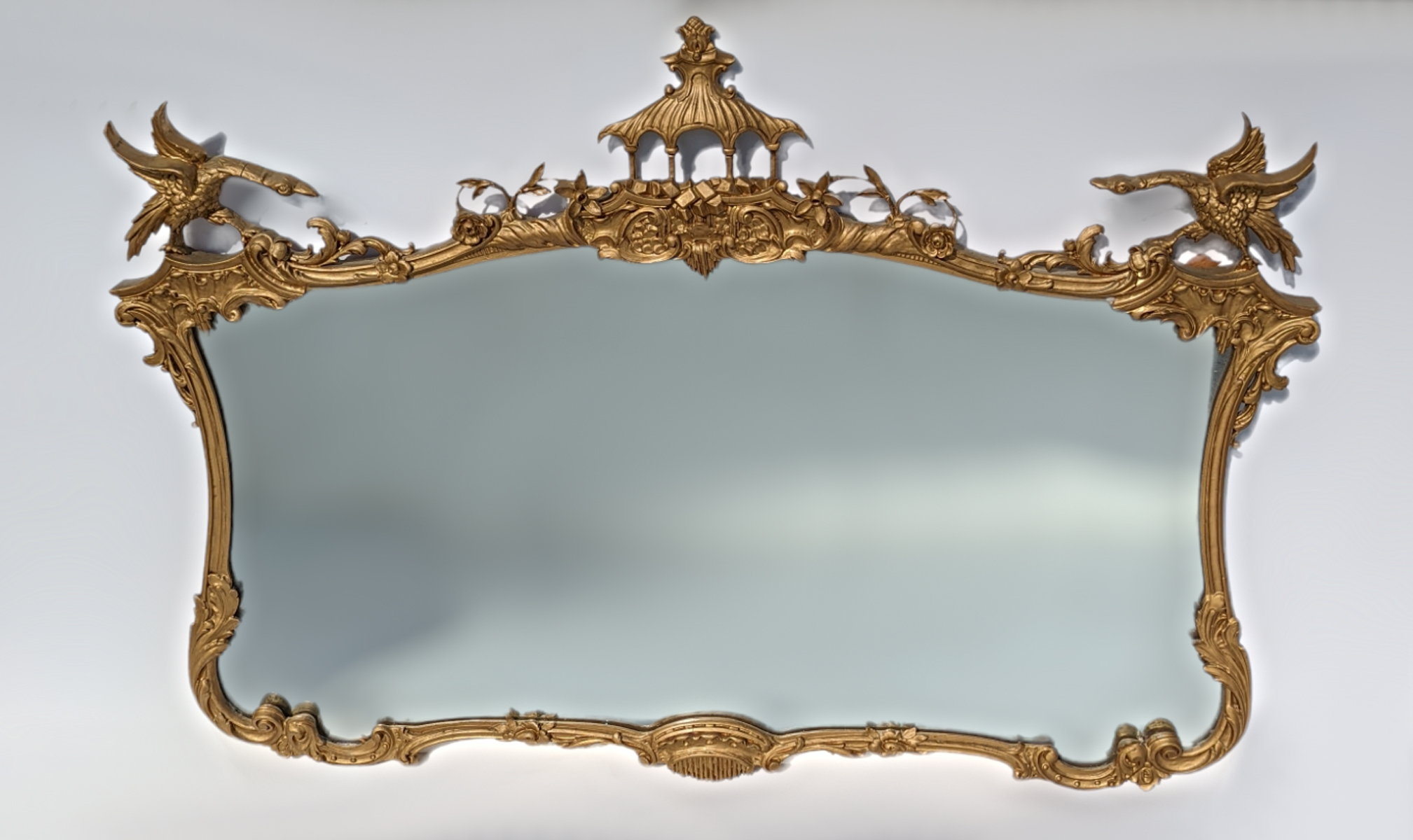 Appraisal: LARGE CHIPPENDALE STYLE CARVED MIRROR Shaped mirror having a carved