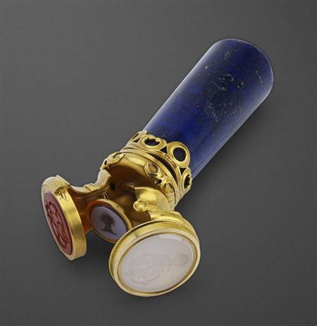 Appraisal: An unusual Russian gold-mounted lapis lazuli hand seal with three