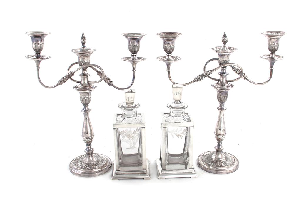 Appraisal: Sterling-clad decanters and pair plated candelabra pair etched-crystal decanters H