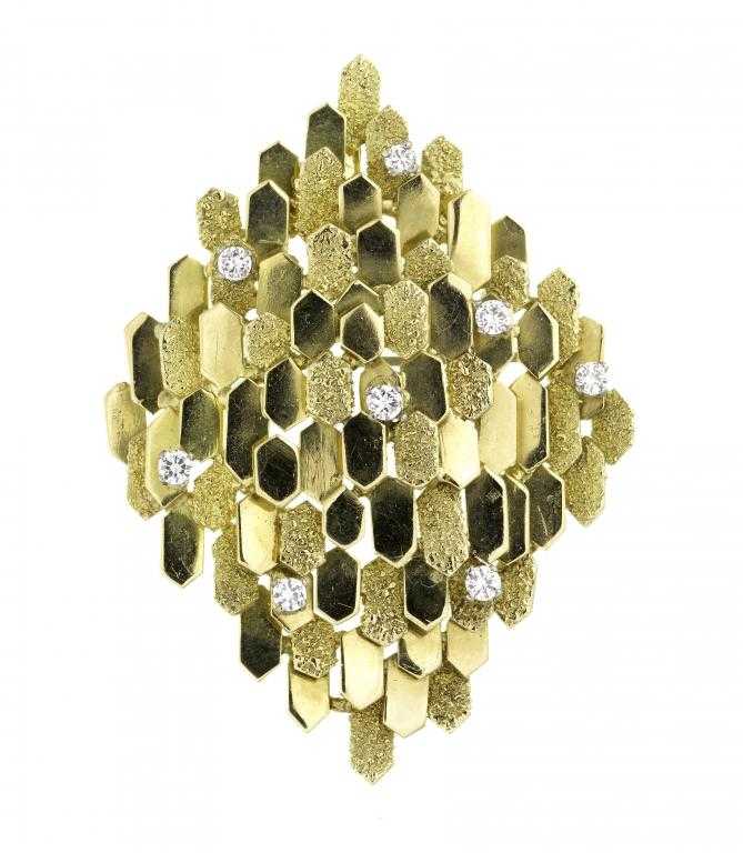 Appraisal: A DIAMOND BROOCH-PENDANT of lozenge shape and formed of overlapping