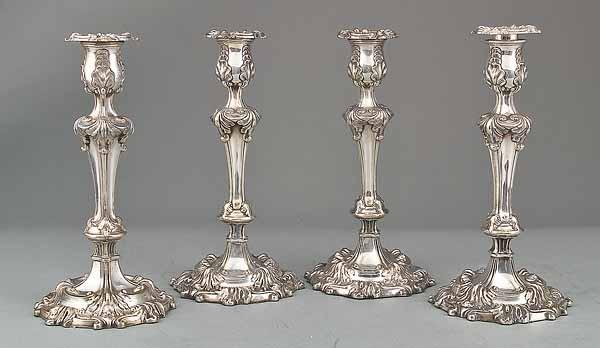 Appraisal: A Set of Four Antique Sheffield Plate Candlesticks in the