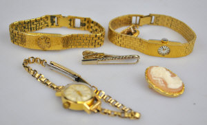 Appraisal: Three ladies' gilt metal wristwatches to w two brooches and