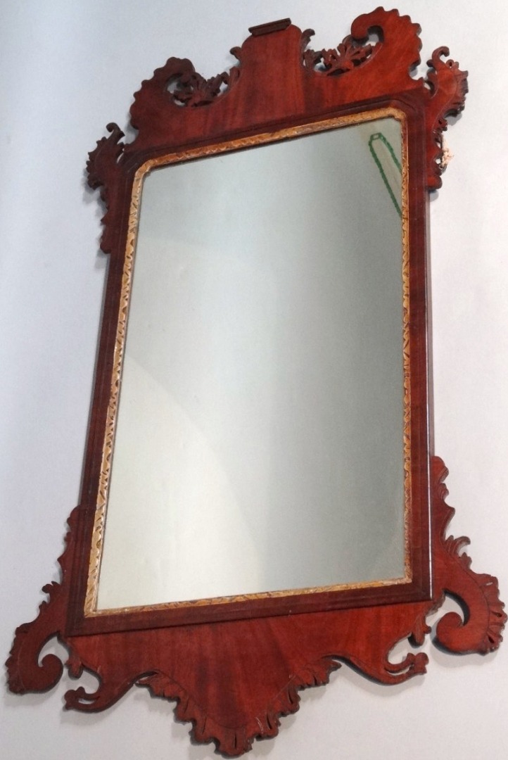 Appraisal: A thC mahogany framed pier glass with a shaped scroll