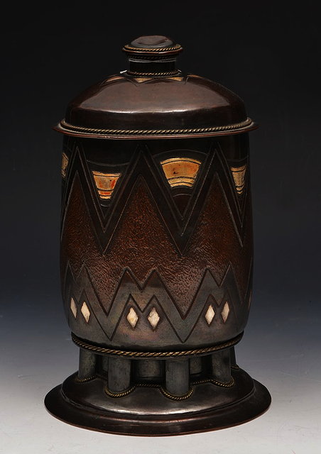 Appraisal: A CONTINENTAL ARTS CRAFTS DESIGN COPPER JAR AND COVER incised