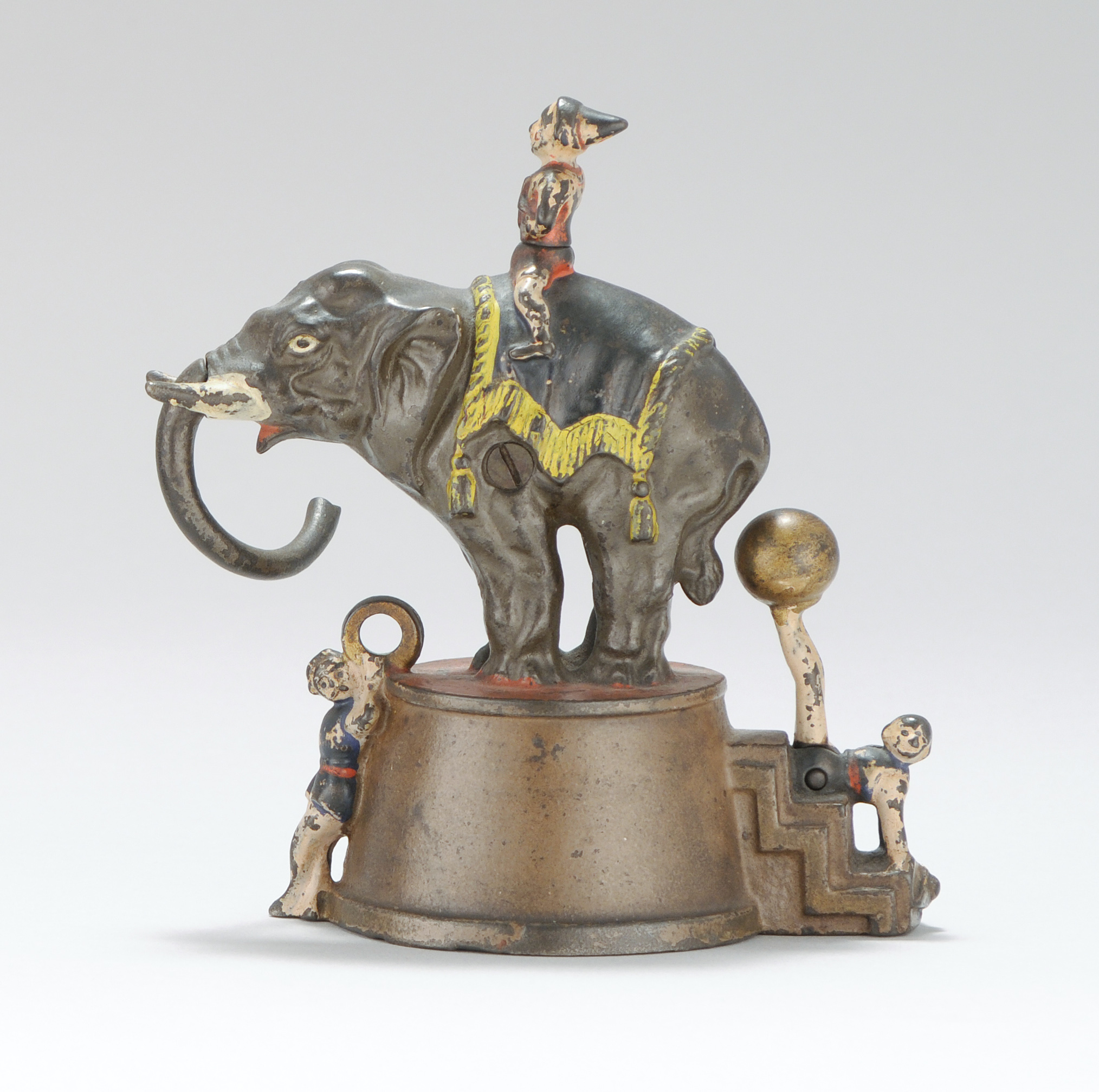 Appraisal: ELEPHANT AND THREE CLOWNS CAST IRON MECHANICAL BANK Patented By