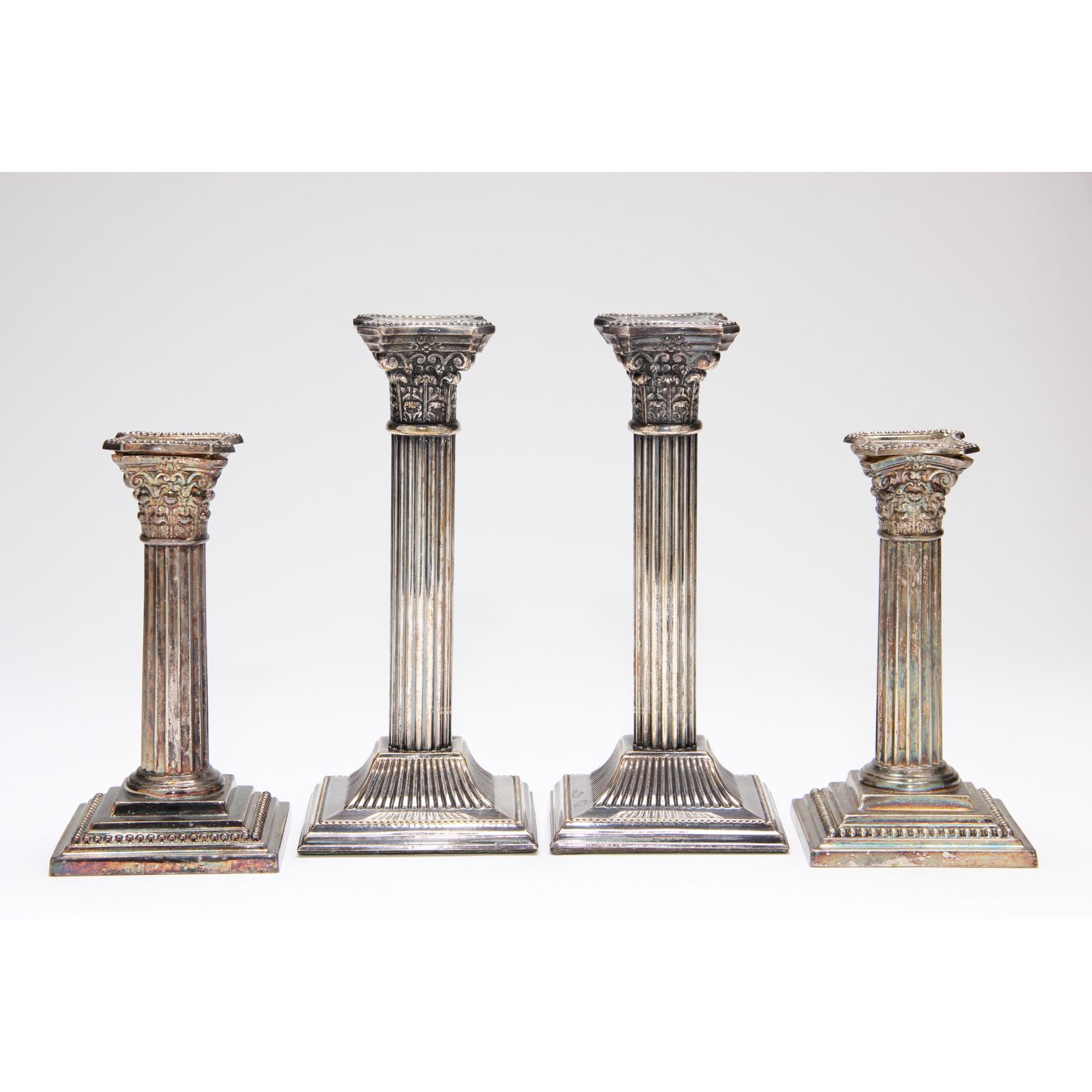 Appraisal: Two Similar Pairs of Antique Silverplate Candlesticks each in the