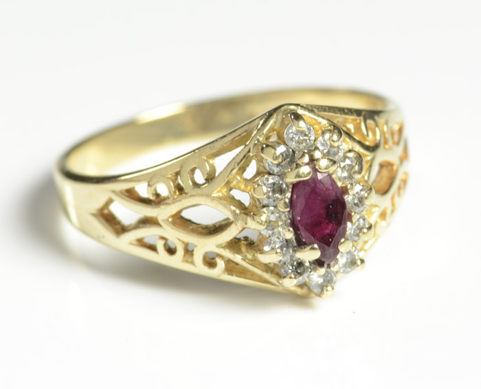 Appraisal: RUBY DIAMOND AND FOURTEEN KARAT GOLD RING with twelve round-cut