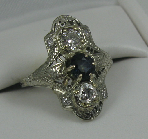 Appraisal: SAPPHIRE DIAMOND AND FOURTEEN KARAT WHITE GOLD RING centering a